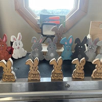 Painted and engraved wood Easter rabbits