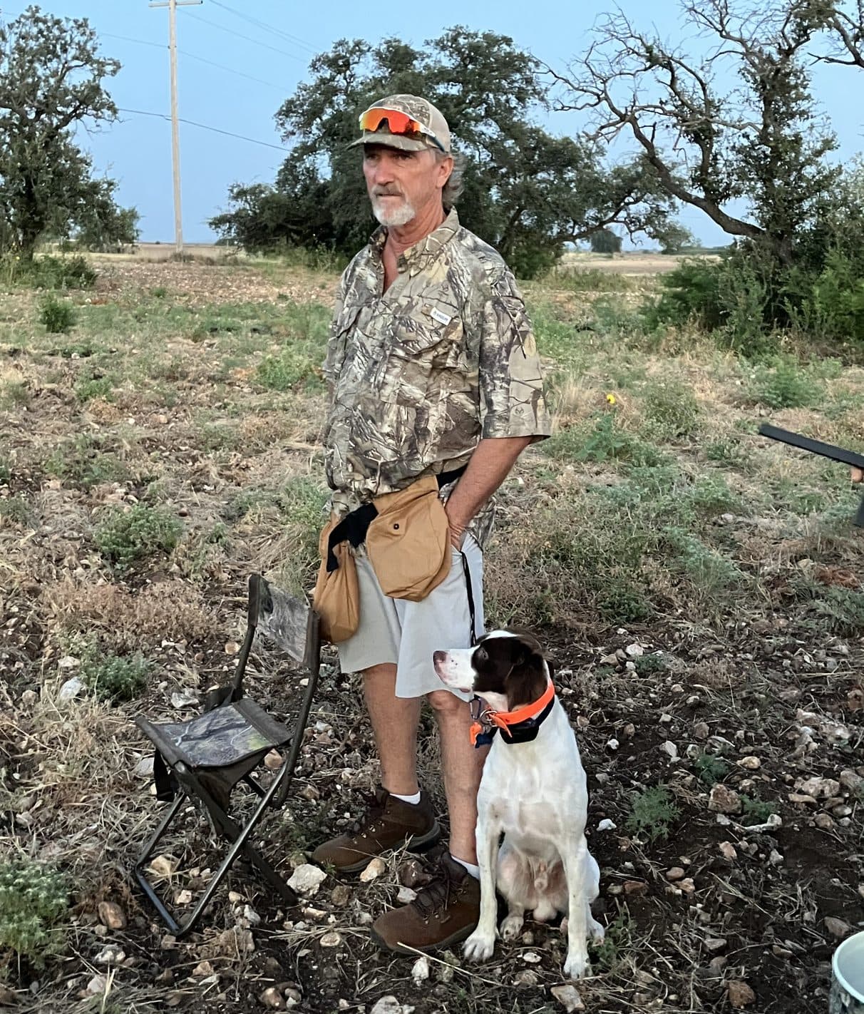Paul Tadlock and his bird dog out in the Texas Hill Country